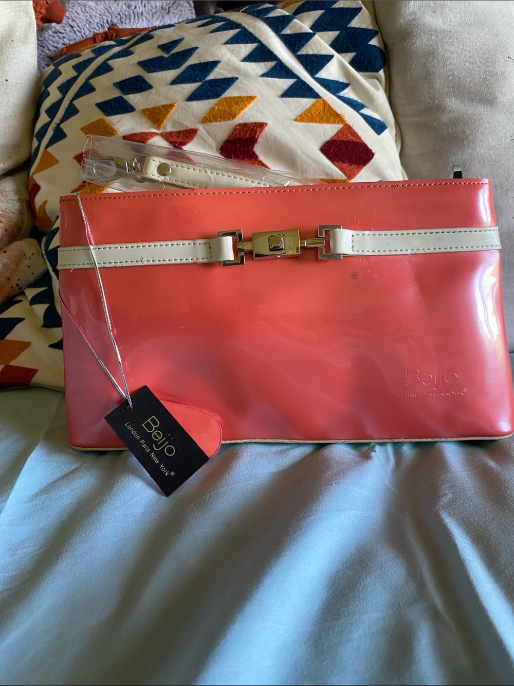 Beijo Coral-Orange Patent Wristlet with Cream Trim